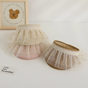 Kids lace sun visors in pink, beige, and brown with gold polka dot mesh and straw brim