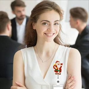 Retractable badge reel featuring a festive Santa Claus design for office ID cards