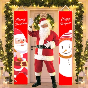 Detail of red Merry Christmas and Happy Newyear door banners hanging with festive lights