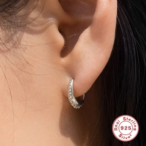 Minimalist S925 sterling silver beaded hoop earring worn on ear for a stylish look