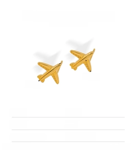 Close-up of 18K gold plated airplane earrings with 11mm x 4.6mm dimensions and 1.1g weight