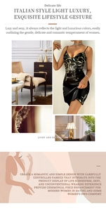 Detail view of black satin slip dress with golden floral patterns in luxury style