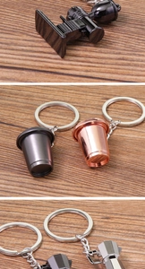Detail of 3D coffee keychain featuring mini metal moka pot and espresso cup accessories