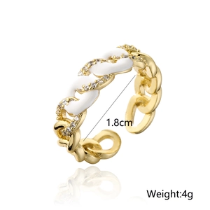 Detail showing 1.8cm diameter and 4g weight of gold chain ring with white enamel