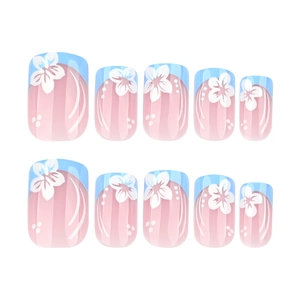 Short square press-on nails with light pink gradient, blue French tips and white flowers