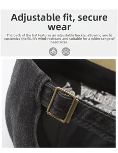 Detail of adjustable metal buckle on dark gray vintage washed baseball cap strap