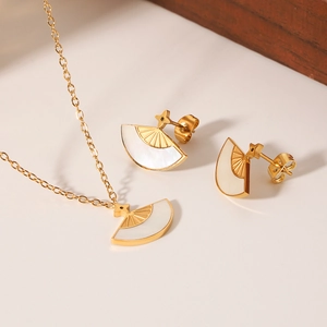 Golden fan-shaped necklace and earring set with white mother of pearl inlay on wood