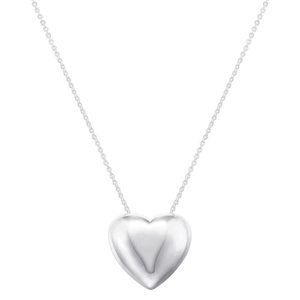 Macro shot of polished silver heart pendant on a delicate chain with a glossy finish