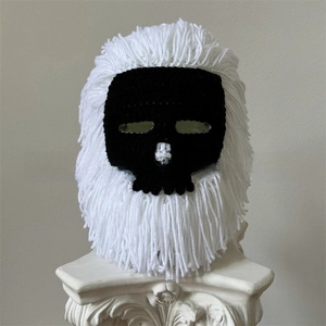 Detailed handmade crochet skull balaclava featuring contrasting black and white fringe decor