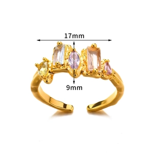 Macro detail of gold open ring showing multi-color zircon inlay with 17mm width size