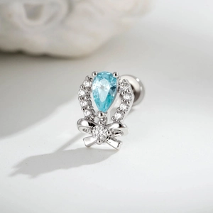 Bow-knot cartilage stud earring with blue pear-shaped zircon and micro-paved crystals