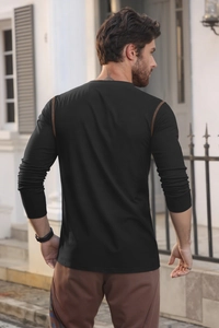 Rear view of black long sleeve polo shirt featuring brown contrast stitching on shoulders