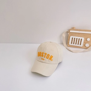 Detailed view of beige cotton kids baseball cap with yellow Boston 1630 embroidery