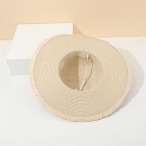 Women's summer straw hat with wide fringe brim and bow ribbon for beach vacation