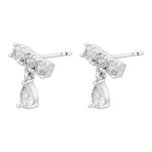 Detail of silver drop earrings featuring pear and round cut cubic zirconia tassels