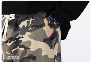 Close-up of portable side pocket on men's camouflage cargo pants with drawstring waist