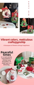 Detailed view of DIY Christmas bauble boxes featuring Santa Claus and tree paper cutouts