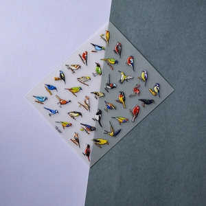 Macro shot of 5D bird embossed nail stickers TS-097 with colorful detailed avian patterns