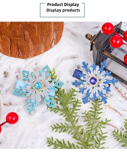 Detail of snowflake hair clips with rhinestones and ribbon on a winter display