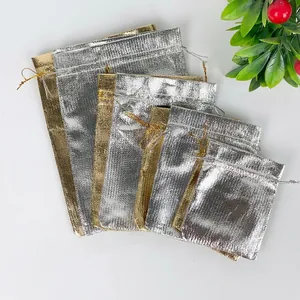 Metallic gold and silver drawstring jewelry pouches in various sizes with shiny texture