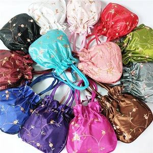Ethnic silk drawstring handbags with floral embroidery in multiple vibrant colors