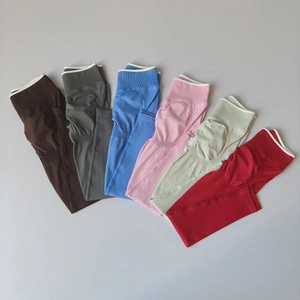 Detailed flat lay of high-waisted seamless yoga pants in six vibrant colors and textures