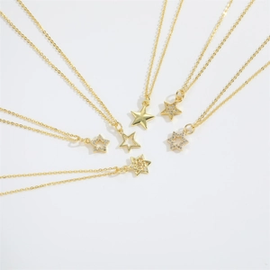 Set of 6 gold star necklaces including hollow, solid, and rhinestone pendant styles