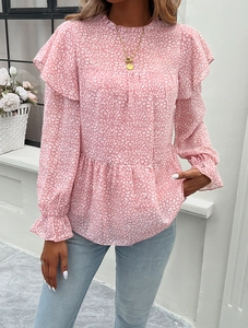 Detail of pink leopard print blouse with ruffle trim and long sleeves for women