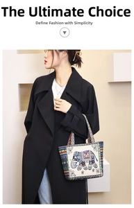 Detailed close-up of ethnic canvas tote bag featuring elephant embroidery and woven strap