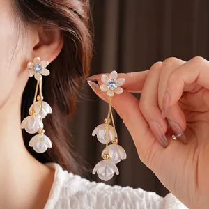 Elegant floral tassel earrings with pearl petals and zircon studs for a French vintage look