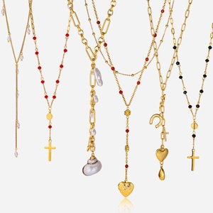 Golden titanium steel cross necklace set with heart shell pendants and pearls
