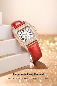 Detail of a square quartz watch with rose gold diamond case and red leather strap