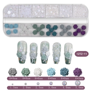 Detail of 12-grid nail art set with mixed resin roses and various sized faux pearls