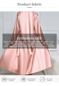 Detailed view of pink satin robe showing smooth fabric texture and fluid drape quality