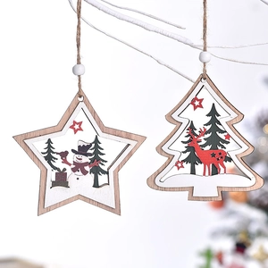 Wooden star and Christmas tree ornaments featuring snowman and reindeer carvings