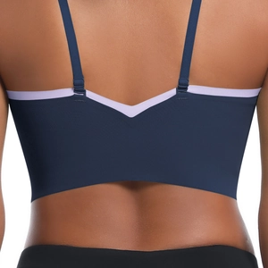 Close-up of women's sports bra back showing navy and lavender panels with racerback cut