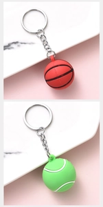 Detailed view of red basketball and green tennis ball keychains with metallic rings