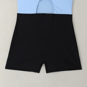 Detail of light blue cutout bodice and high-waisted black boyleg swimsuit bottoms