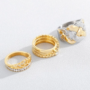 Golden vintage stainless steel rhinestone rings set for women on white background