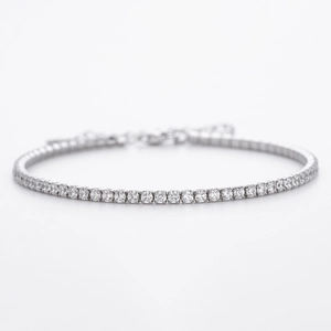 Detail of silver tennis bracelet with cubic zirconia inlay and adjustable lobster clasp
