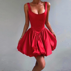 Detail of red satin sleeveless mini dress with corset bodice and pleated bubble skirt