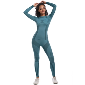 Detail of teal seamless knitted thermal yoga set with compression textures and high waist