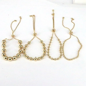 Adjustable gold bead bracelets in four sizes with polished metallic finish for women