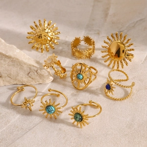 Bohemian 18k gold plated sunflower rings with turquoise stones on white stone back