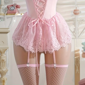 Pink lace lingerie set with corset top, garter belt, and fishnet stockings on a model