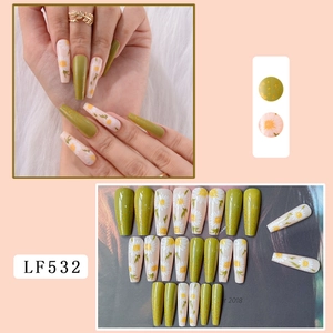 Long coffin fake nails featuring olive green gold foil and daisy floral nail art details