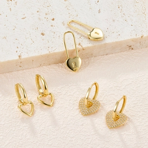 Detailed view of S925 sterling silver heart earrings with zircon inlay and 18K gold finish