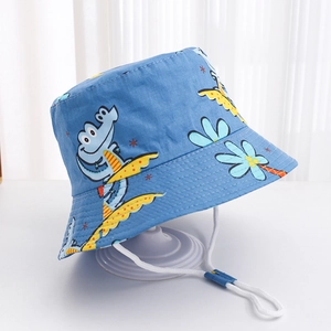 Close-up of blue cotton sun hat for kids with cartoon crocodile prints and windproof cord