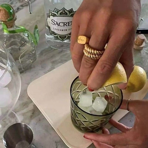 Golden croissant twist ring and signet ring set for women in casual lifestyle setting