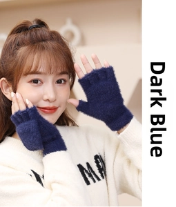 Detail of dark blue faux mink fur fingerless gloves with soft knitted texture for winter